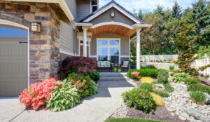 A well maintained home entryway with plantings outside